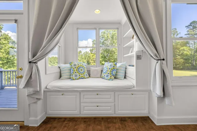 a bathroom with a sink a light fixture and a mirror