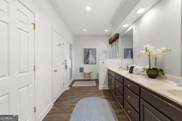 a white toilet sitting next to a bath tub