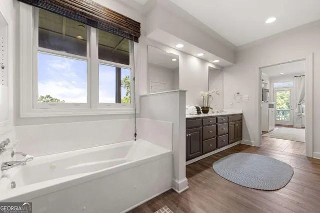 a balcony with wooden floor and fence