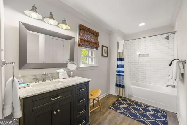 a view of a kitchen with a window and wooden floor