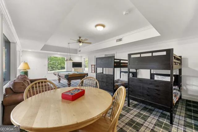 a view of a backyard with sitting area