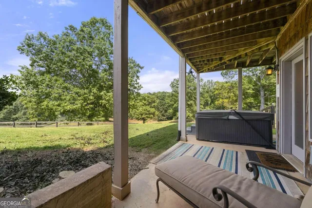 a view of livingroom with furniture and window