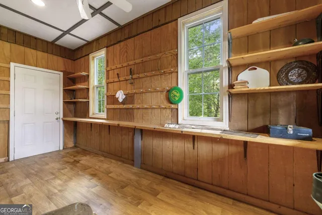 a view of a livingroom with furniture and a window