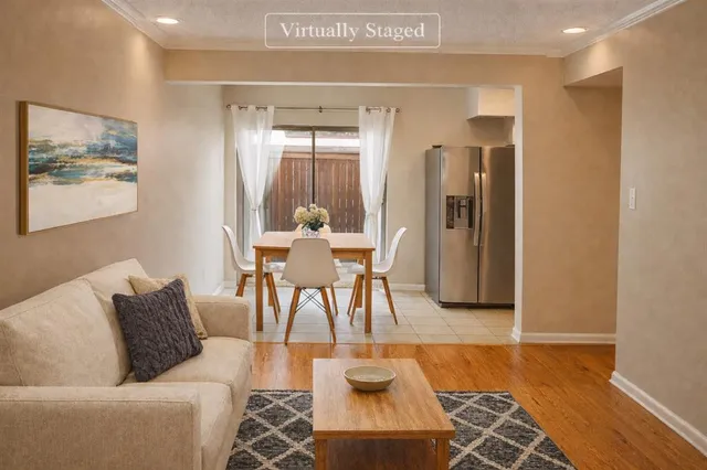a living room with furniture and a rug