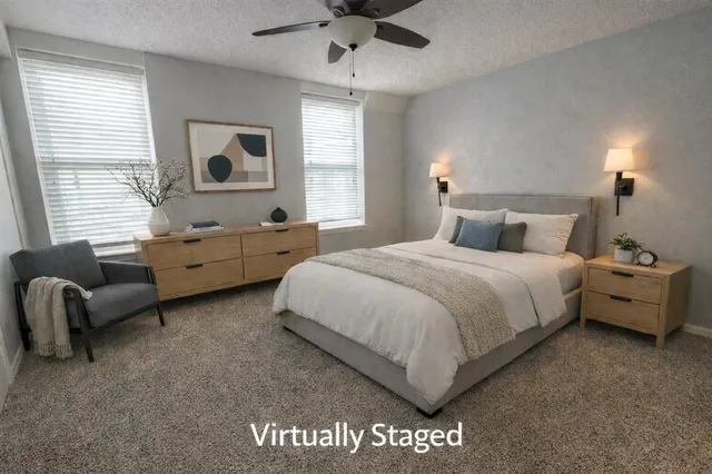 a bedroom with a bed and a couch