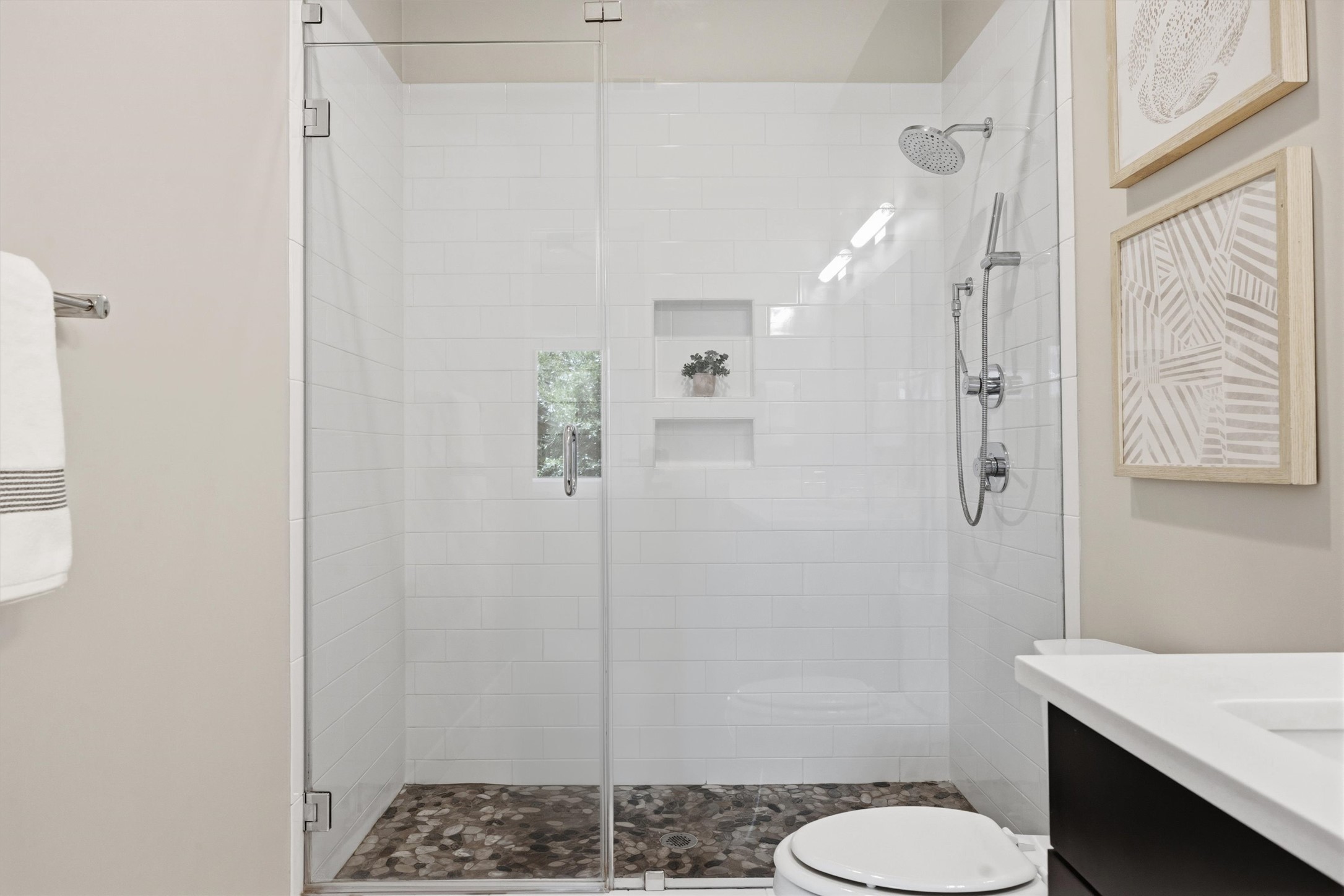 2314 Enfield Road, Unit 203 Austin, TX 78703 - Photo 22 of 37 The glass-enclosed walk-in shower features a classic white subway tile.