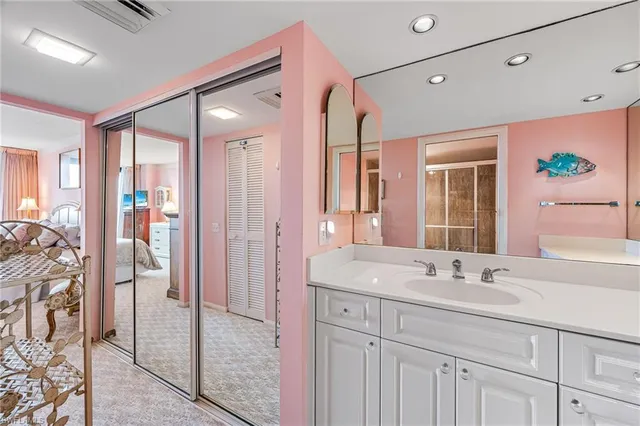 a bathroom with a double vanity sink and mirror