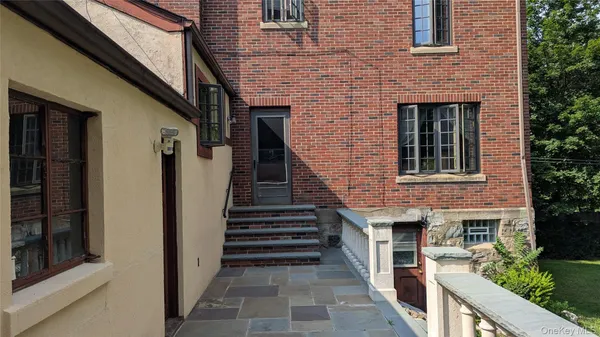 a view of a brick house stairs of a house