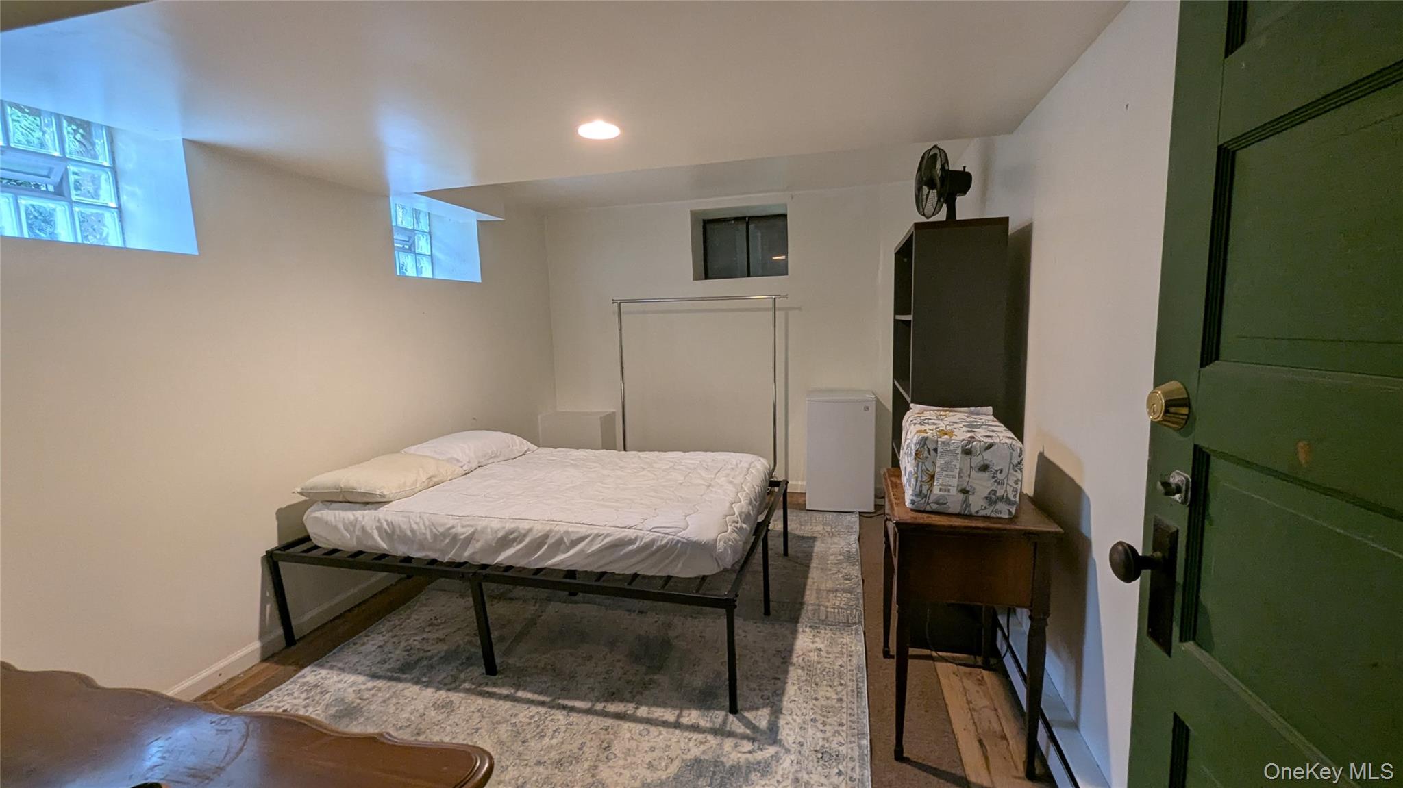 78 Roe Avenue Highland Falls, NY 10928 - Photo 34 of 41 a bed sitting in a bedroom next to a window with kitchen