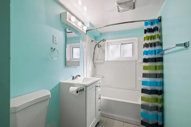 a utility room with a sink dryer and washer