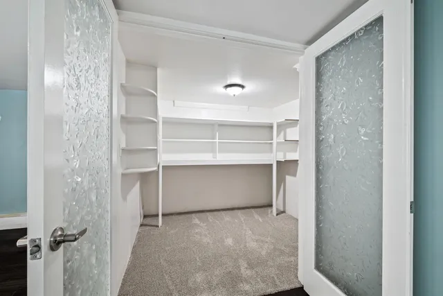 a yellow building with trees in front of it