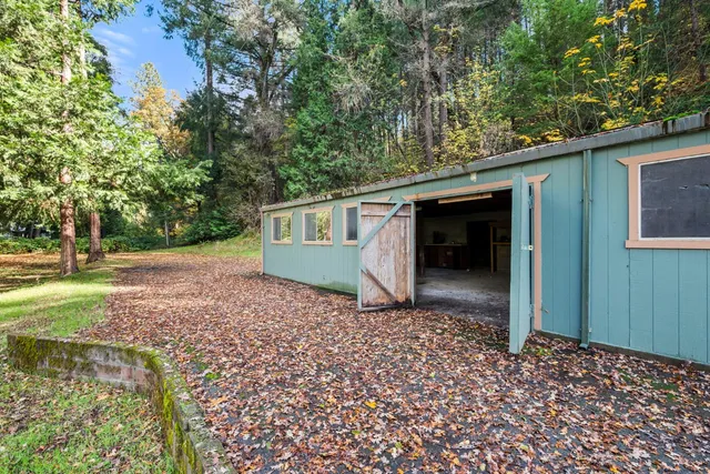 a living room with a fireplace and a flat screen tv