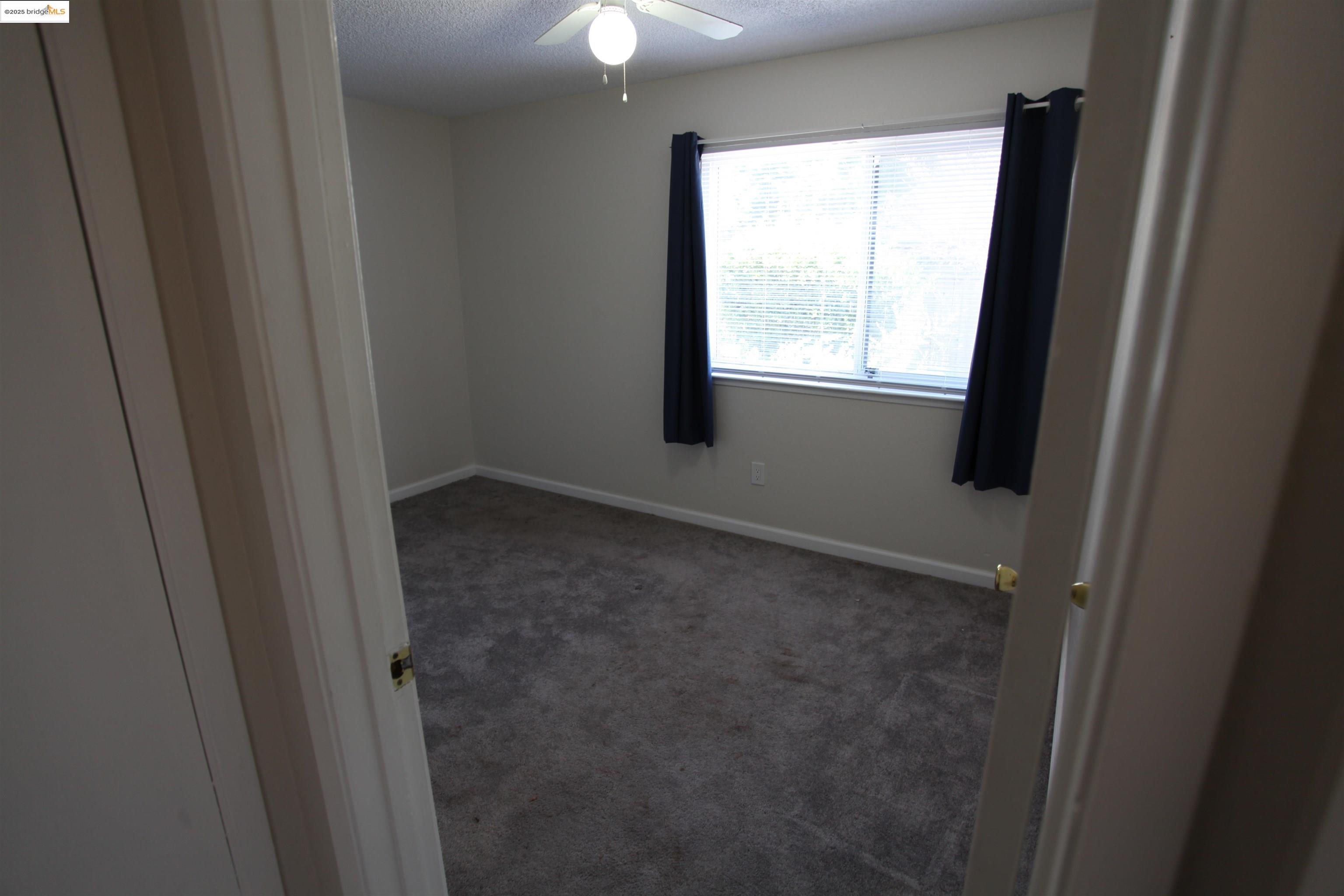 3044 Winterbrook Drive Bay Point, CA 94565 - Photo 14 of 18 a view of an empty room with a window
