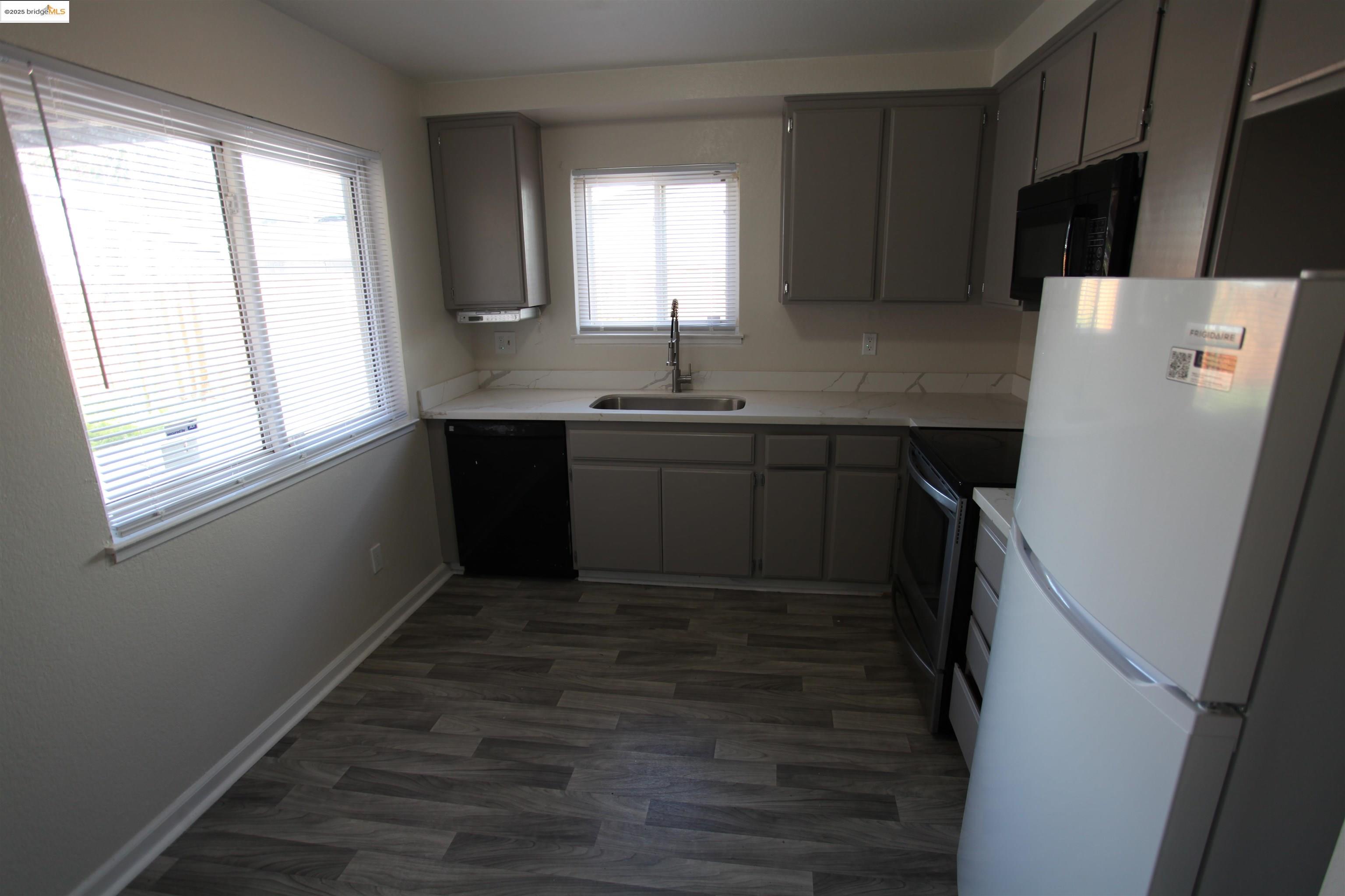 3044 Winterbrook Drive Bay Point, CA 94565 - Photo 6 of 18 a kitchen with a sink a refrigerator and window