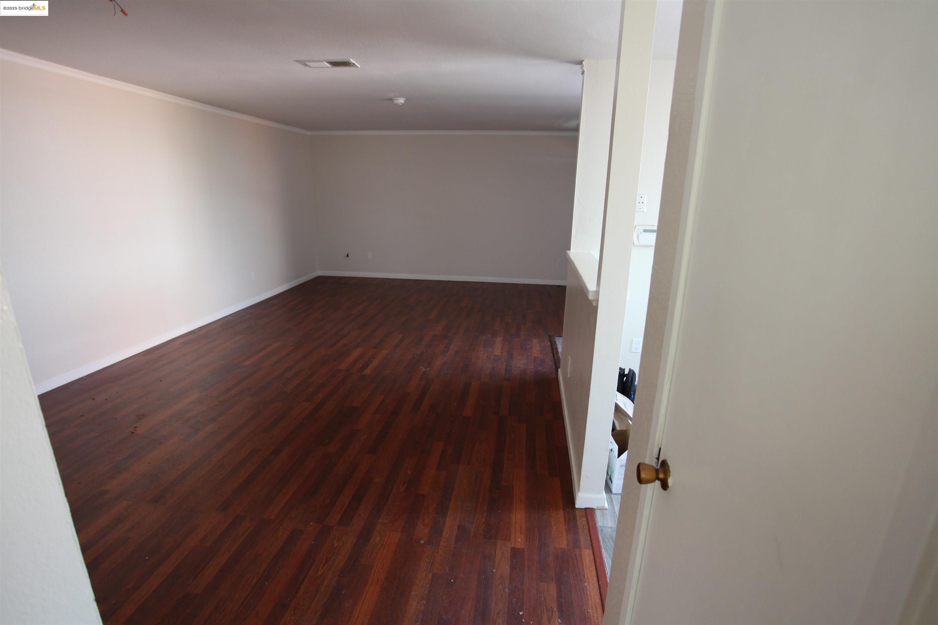 3044 Winterbrook Drive Bay Point, CA 94565 - Photo 8 of 18 an empty room with wooden floor and windows