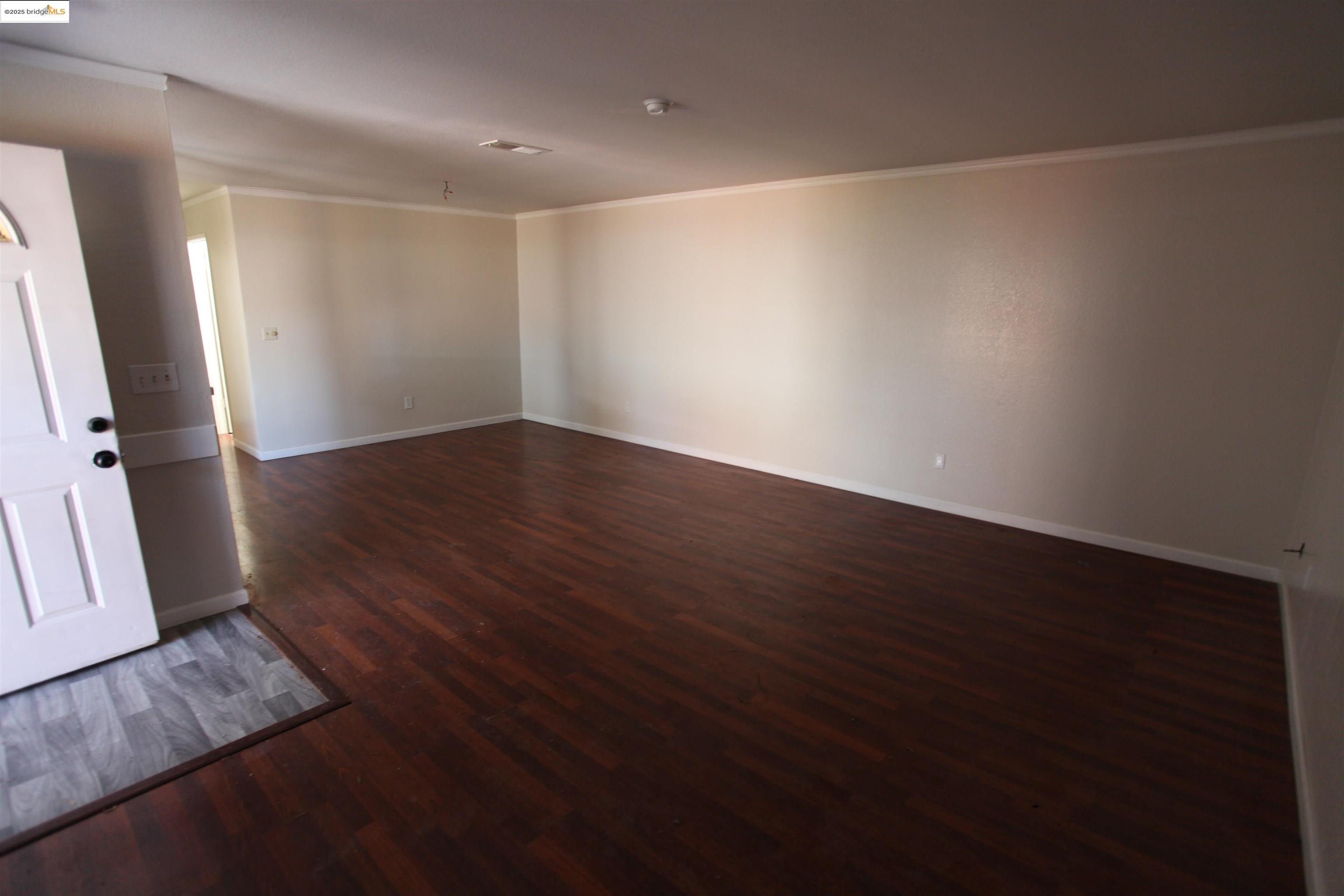 3044 Winterbrook Drive Bay Point, CA 94565 - Photo 10 of 18 an empty room with wooden floor and entrance