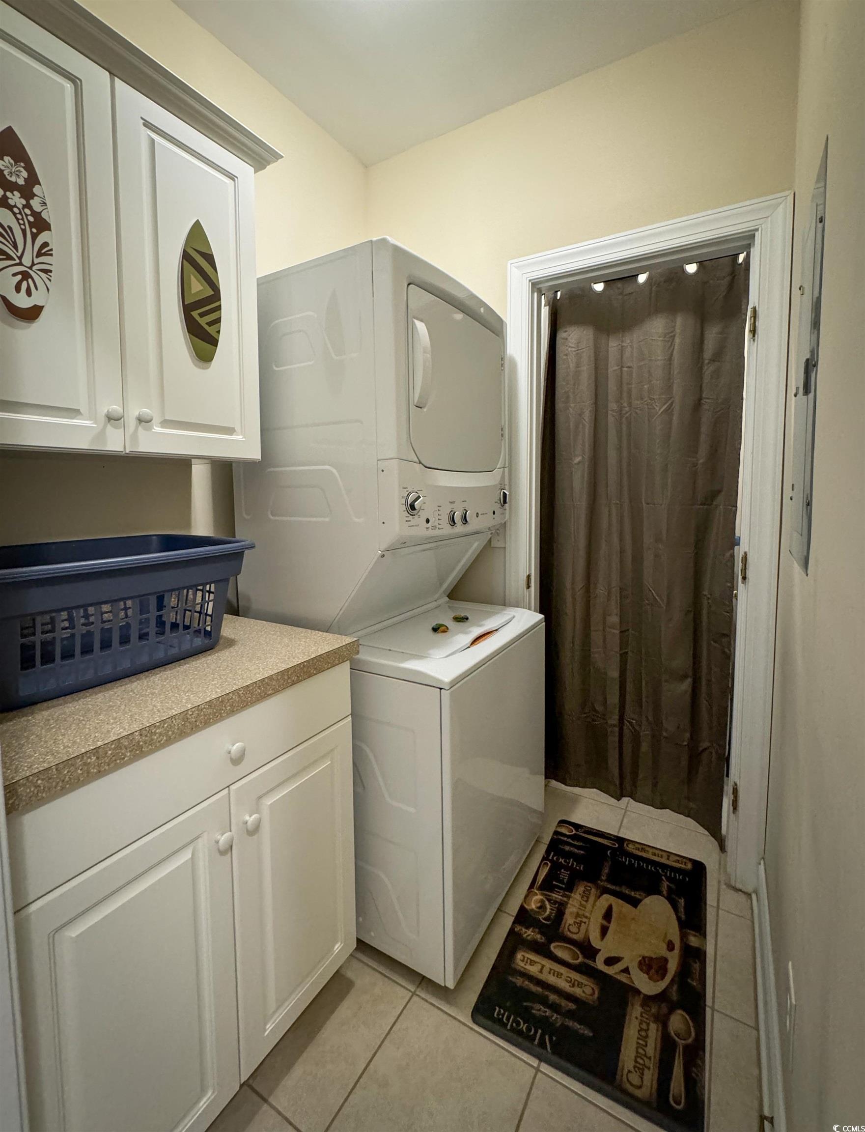 1004 Ray Costin Way, Unit 206 Murrells Inlet, SC 29576 - Photo 17 of 29 Laundry with stacked washer and dryer and storage.