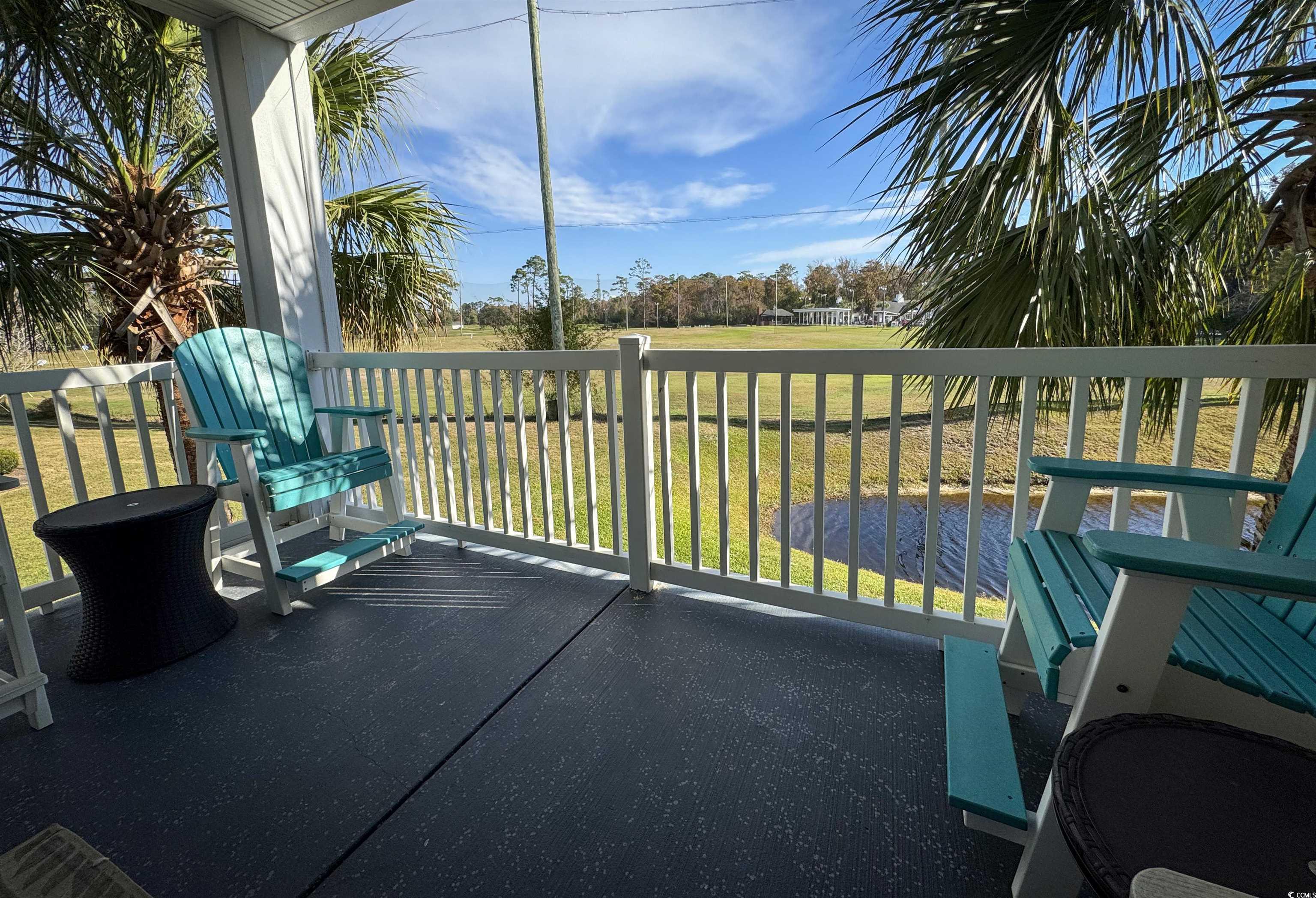 1004 Ray Costin Way, Unit 206 Murrells Inlet, SC 29576 - Photo 18 of 29 Spacious balcony with a view of the pond and driving range