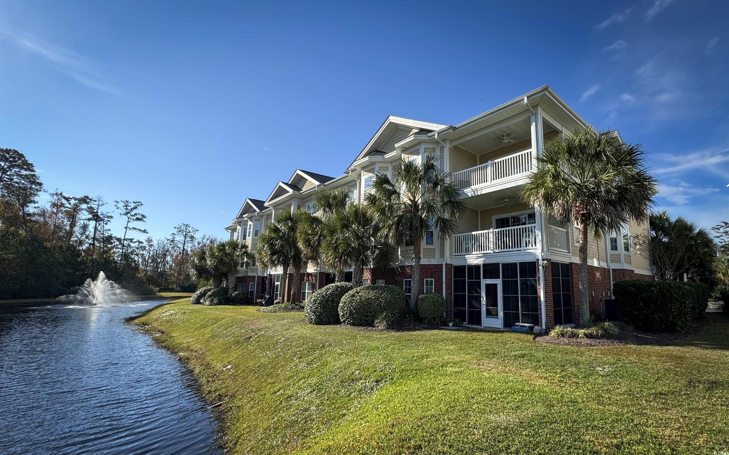 1004 Ray Costin Way, Unit 206 Murrells Inlet, SC 29576 - Photo 3 of 29 View of building exterior with a water view