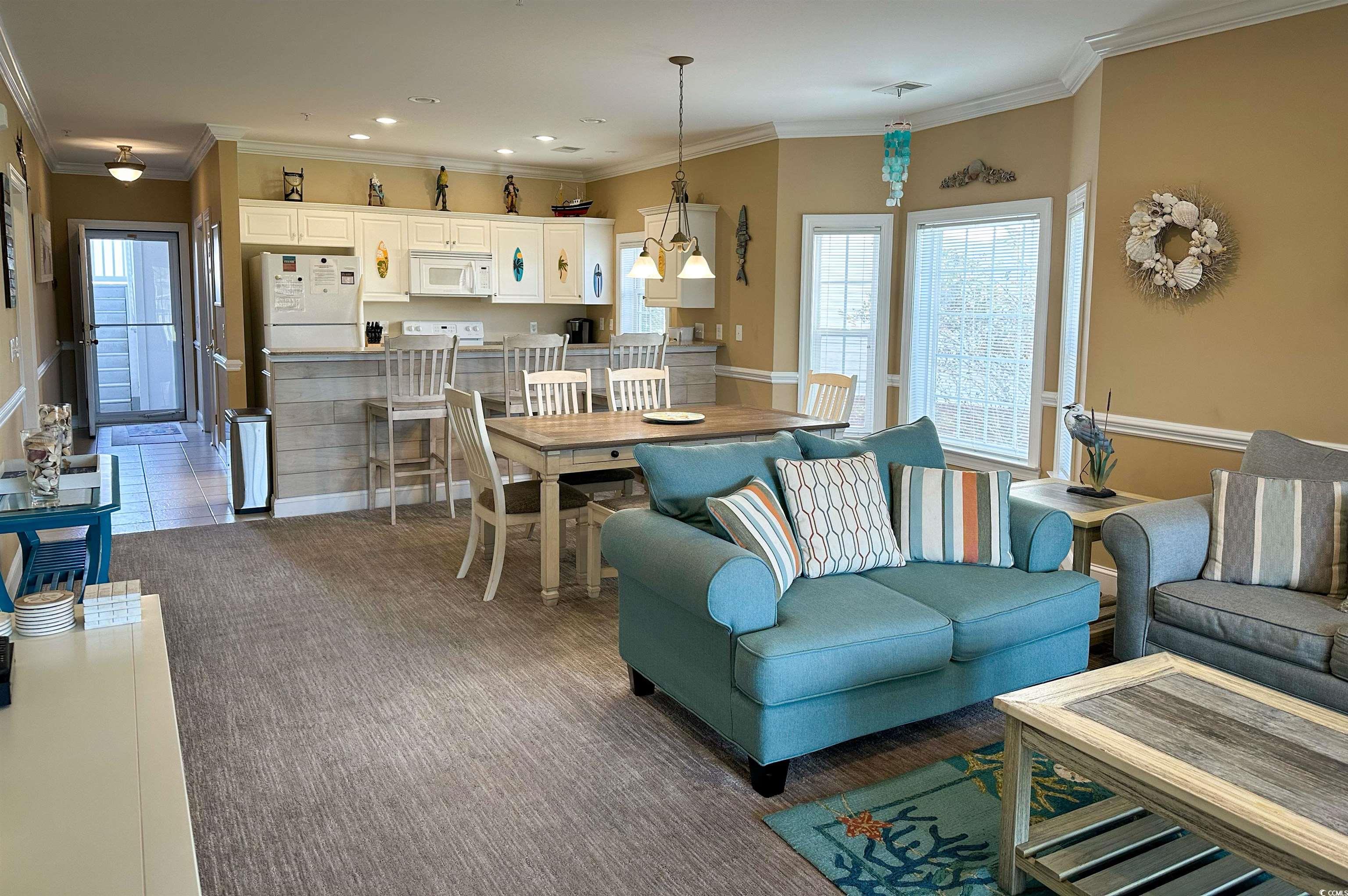 1004 Ray Costin Way, Unit 206 Murrells Inlet, SC 29576 - Photo 6 of 29 Tiled living room with crown molding