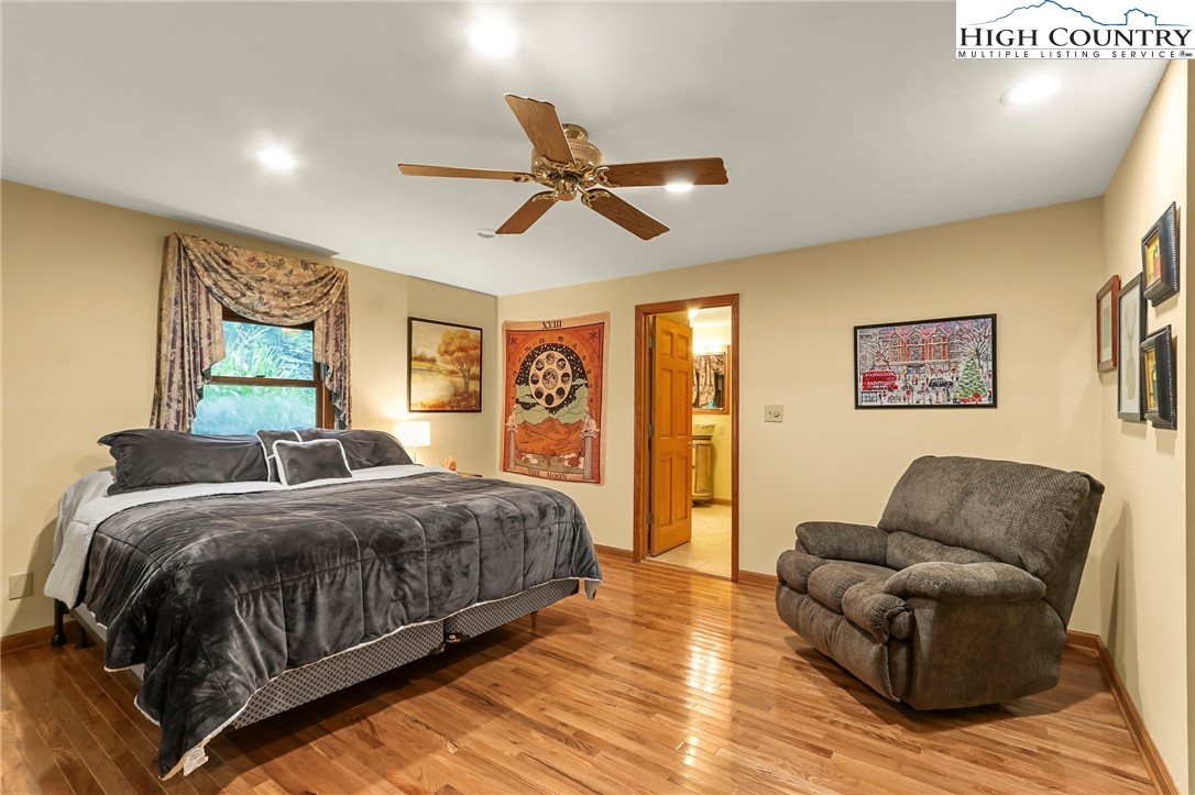 770 Grady Winkler Road Boone, NC 28607 - Photo 13 of 44 a living room with a bed furniture and a window
