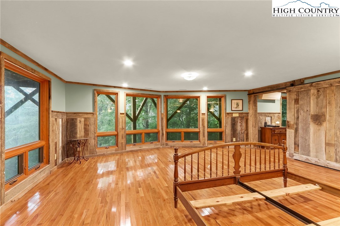 770 Grady Winkler Road Boone, NC 28607 - Photo 26 of 44 a view of a room with wooden floor and windows
