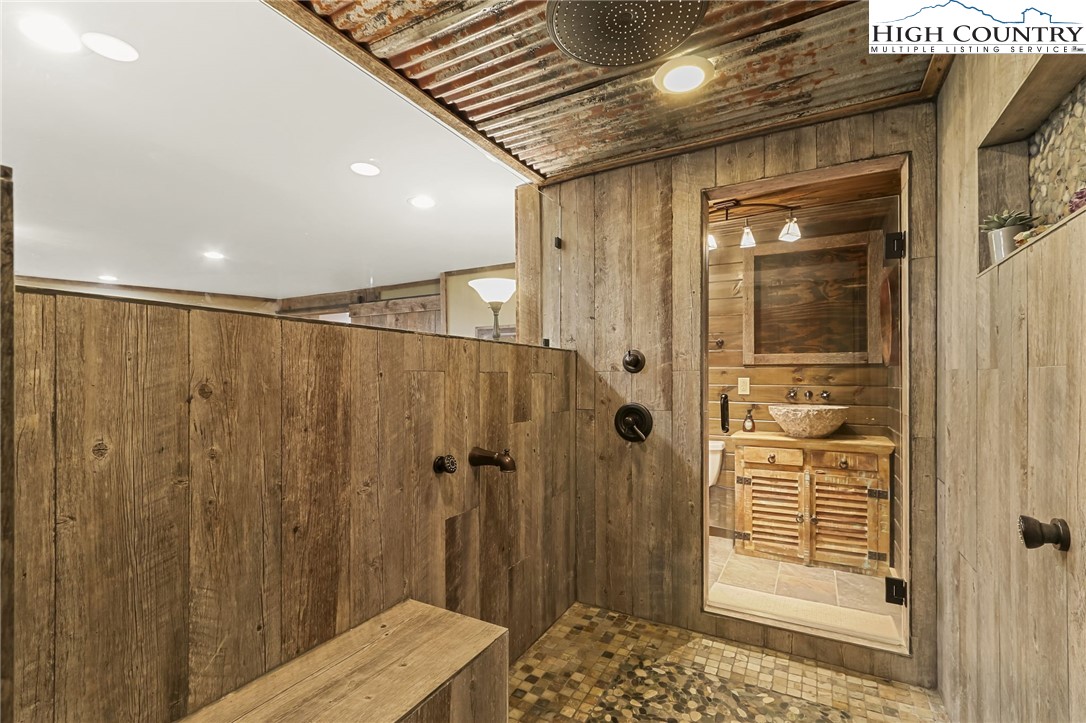 770 Grady Winkler Road Boone, NC 28607 - Photo 29 of 44 a bathroom with a shower and a sink