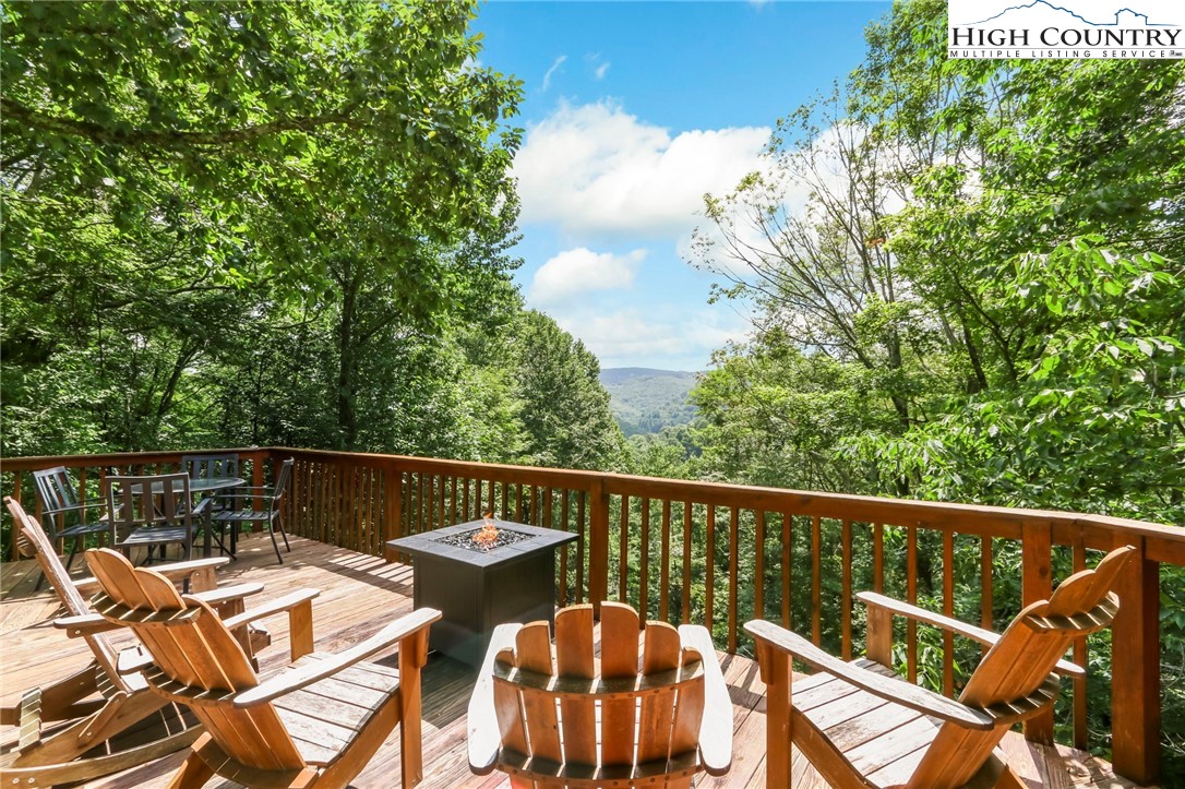 770 Grady Winkler Road Boone, NC 28607 - Photo 3 of 44 a balcony with wooden floor and outdoor seating