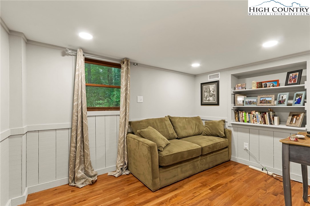 770 Grady Winkler Road Boone, NC 28607 - Photo 31 of 44 a living room with furniture and a book shelf