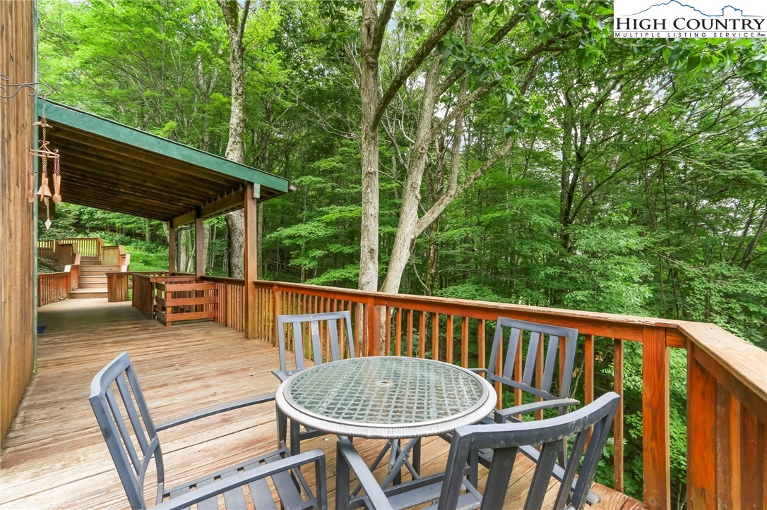 770 Grady Winkler Road Boone, NC 28607 - Photo 34 of 44 a view of a two chairs and table in the balcony