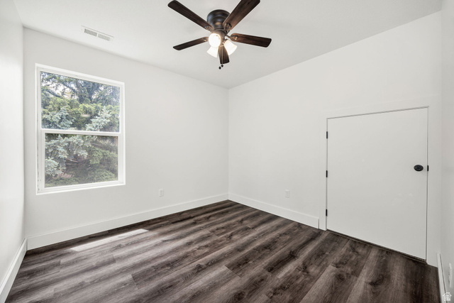 1552 Sumac Drive Logan, UT 84321 - Photo 36 of 72 Room featuring wood-finish flooring, a white window, a white door with a black knob, a ceiling fan with light fixture, and white baseboards