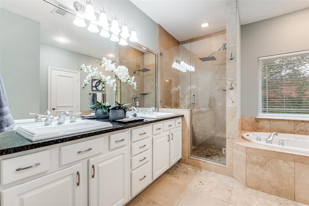 2205 Canton Street, Unit 107 Dallas, TX 75201 - Photo 7 of 12 primary bedroom with seperate shower and tub + double vanity