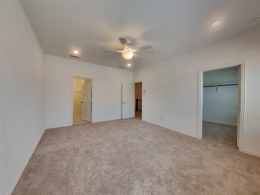 1069 Keene Rdg Drive Allen, TX 75013 - Photo 5 of 10 an empty room with closet and a ceiling fan
