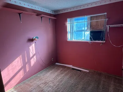 a view of empty room with a window
