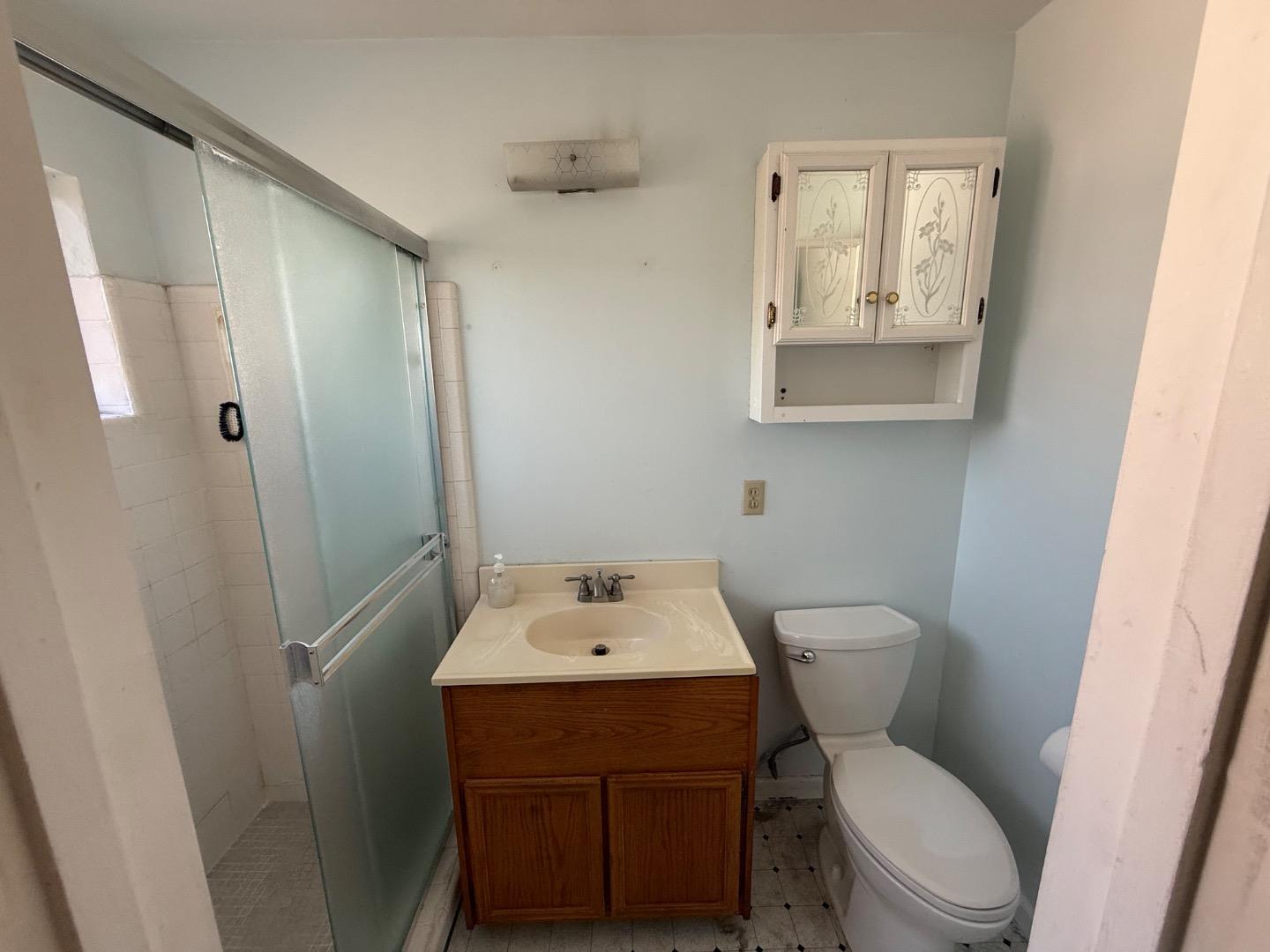 38809 Judie Way Fremont, CA 94536 - Photo 14 of 16 a bathroom with a toilet sink and mirror
