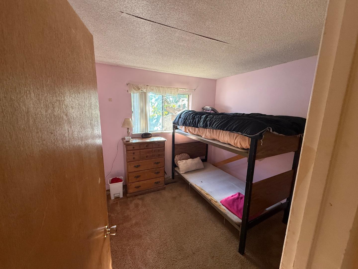 38809 Judie Way Fremont, CA 94536 - Photo 16 of 16 a bedroom with furniture and a window