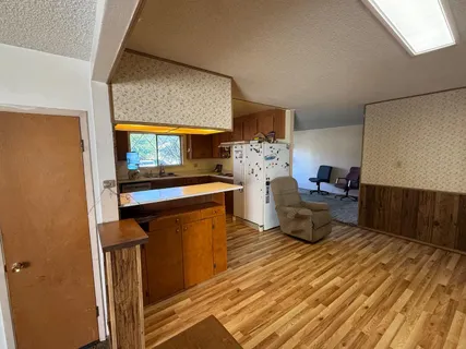 a living room with furniture a rug and a fireplace