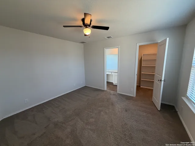 an empty room with a flat screen tv