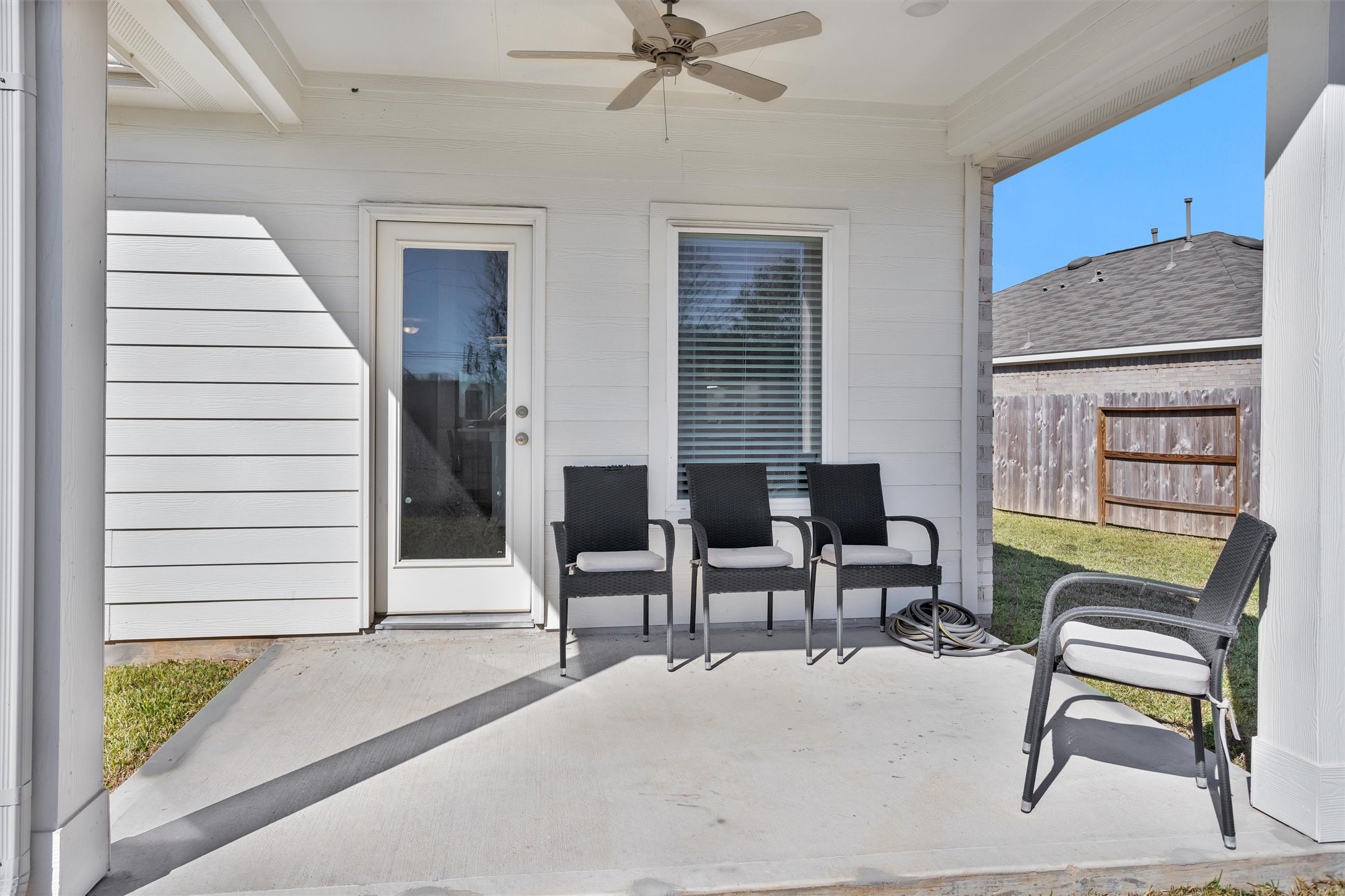 2127 Heather Rdg Way Rosenberg, TX 77471 - Photo 36 of 41 This covered back patio features a ceiling fan, and easy access to the backyard, creating a relaxing space for outdoor dining and entertaining.