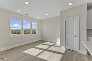 2760 River Meadow Spring Hope, NC 27882 - Photo 17 of 42 a view of an empty room with a window