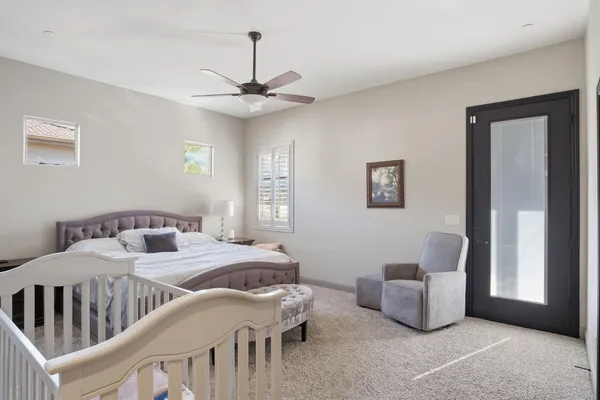 a bedroom with furniture and a window