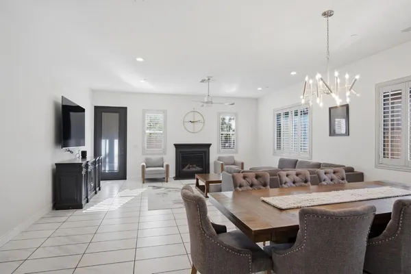 a large kitchen with sink a counter space and stainless steel appliances