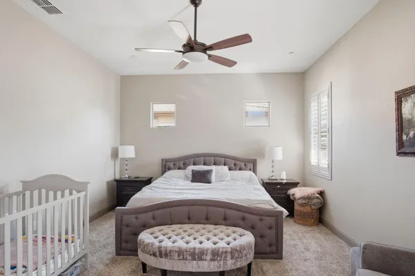 a bedroom with a bed and window