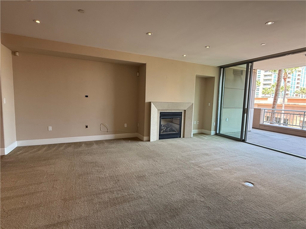 8035 Scholarship Irvine, CA 92612 - Photo 5 of 19 a view of an empty room with window and fire place