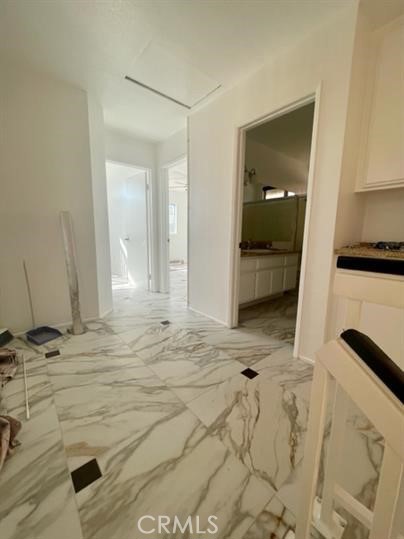 22710 Brompton Street Moreno Valley, CA 92553 - Photo 14 of 23 a bathroom with a sink a mirror and shower