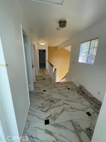 22710 Brompton Street Moreno Valley, CA 92553 - Photo 19 of 23 a view of a hallway to rooms