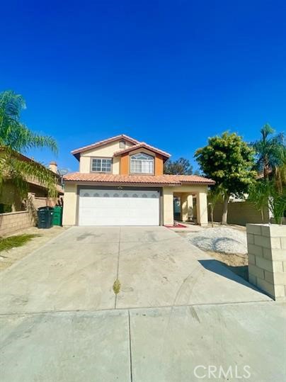 22710 Brompton Street Moreno Valley, CA 92553 - Photo 2 of 23 a front view of a house with a yard