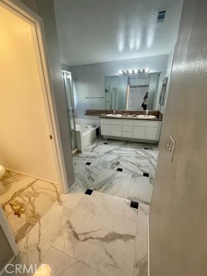 22710 Brompton Street Moreno Valley, CA 92553 - Photo 23 of 23 a bathroom with a tub sink and mirror