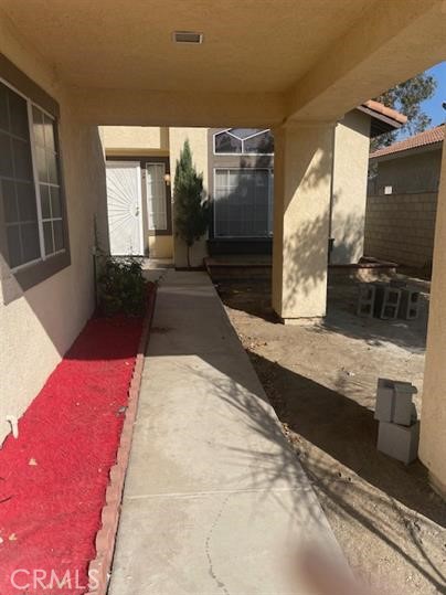 22710 Brompton Street Moreno Valley, CA 92553 - Photo 3 of 23 a view of balcony with a couch