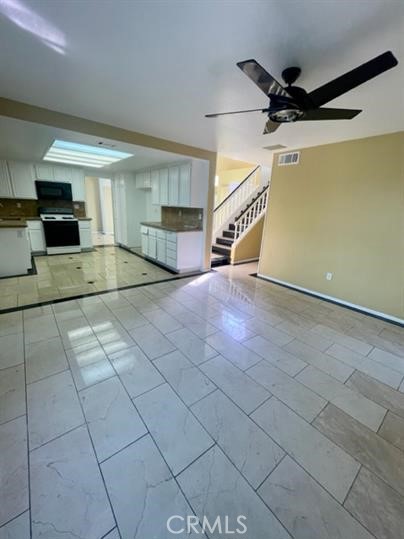 22710 Brompton Street Moreno Valley, CA 92553 - Photo 9 of 23 a view of a livingroom with a furniture and a ceiling fan